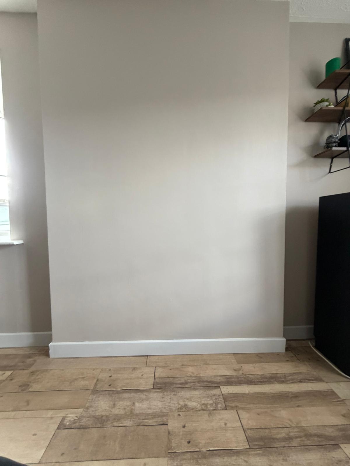 Fireplace removed and wall made good